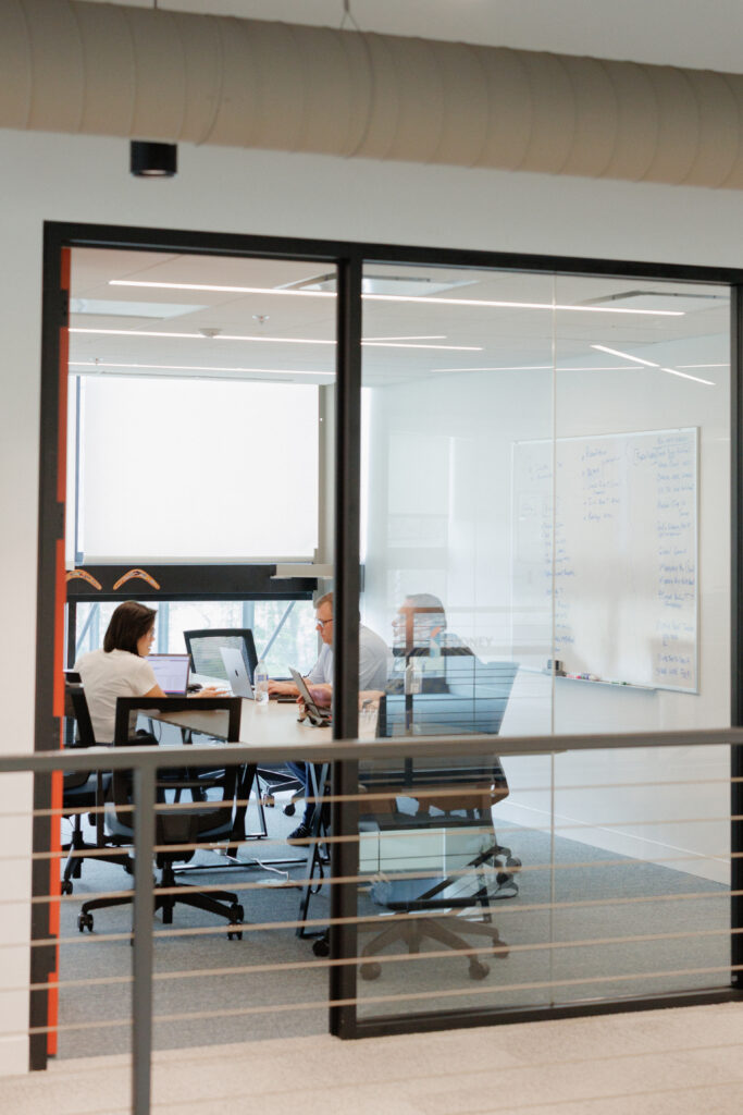 HR leader reviewing incentive travel program communication plan with employee reward announcement materials