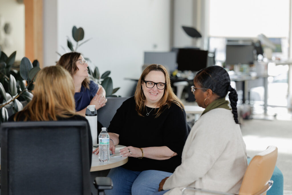 HR leader reviewing incentive travel program success metrics and employee retention data