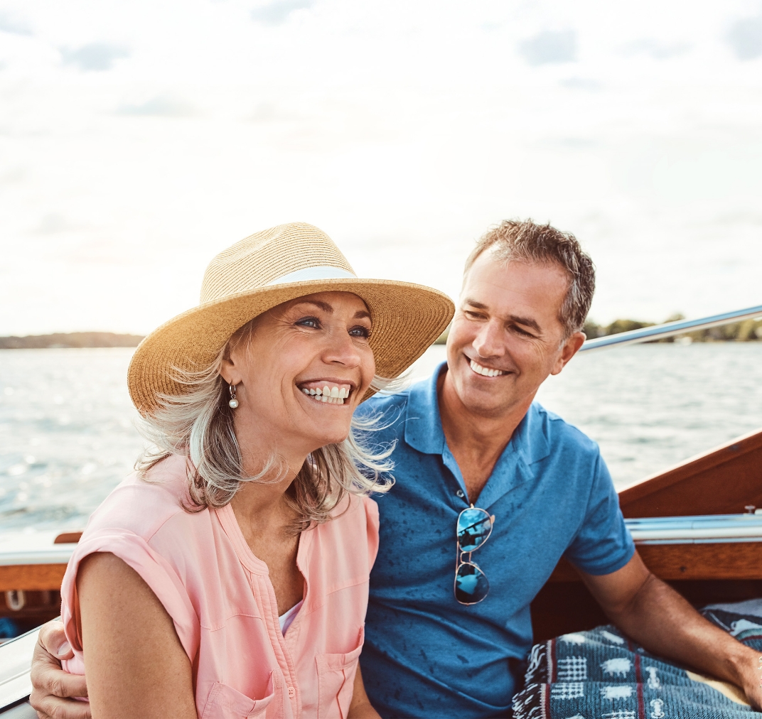Retired couple enjoying a boat trip together